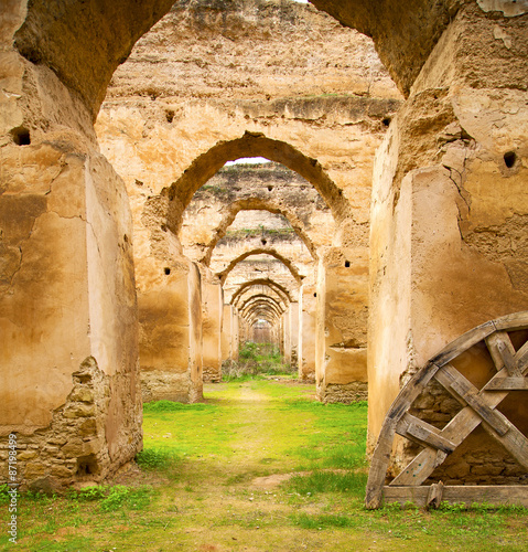 old moroccan granary in the green grass and archway  wall photo