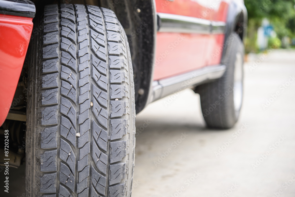 Naklejka premium Car tire on the road