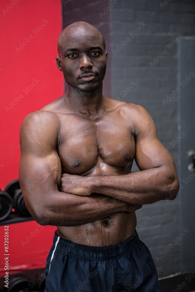 Fototapeta premium Young Bodybuilder posing in front of the camera