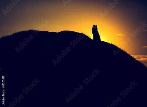 Vintage photo of wedding couple silhouettes in outdoor