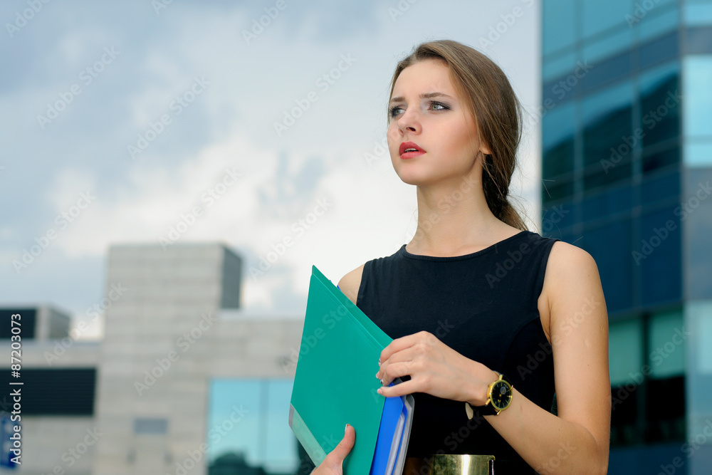 Business woman with folders for papers in her hands Business woman with folders for papers in her hands