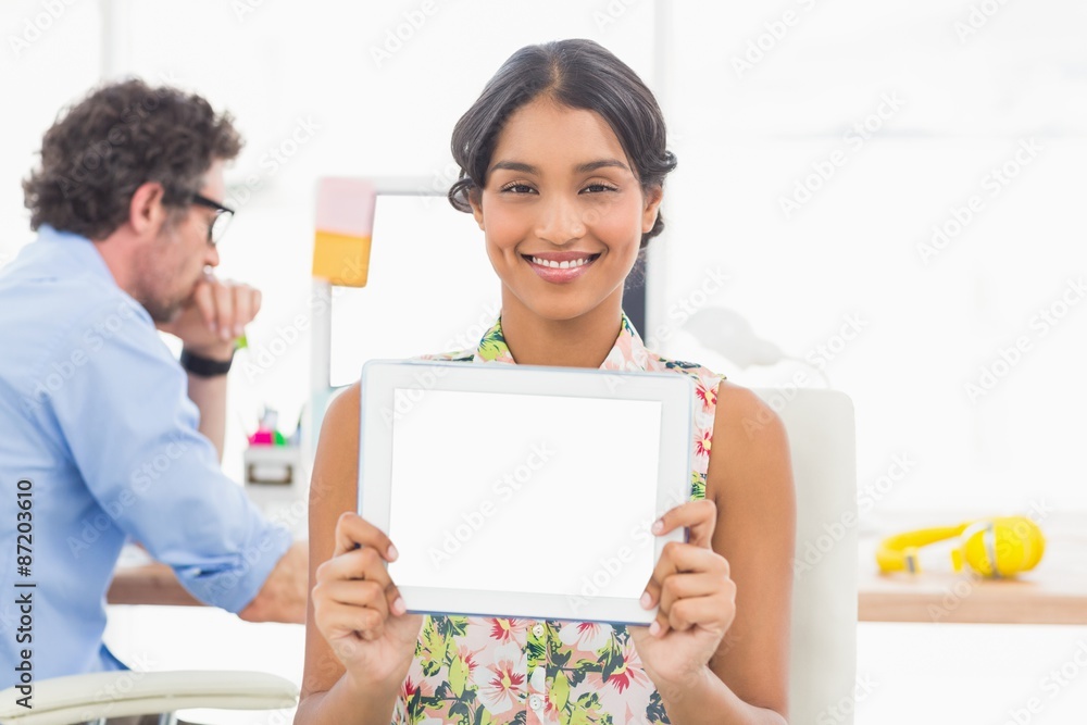 Smiling businesswoman using tablet pc Smiling businesswoman using tablet pc