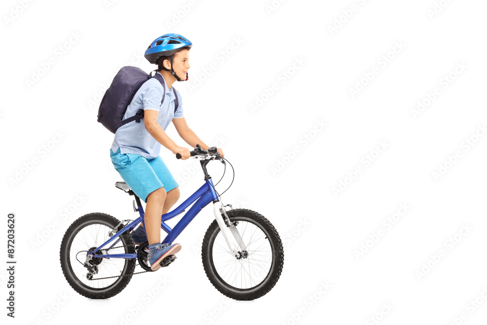 Schoolboy with a helmet riding a bike Schoolboy with a helmet riding a bike