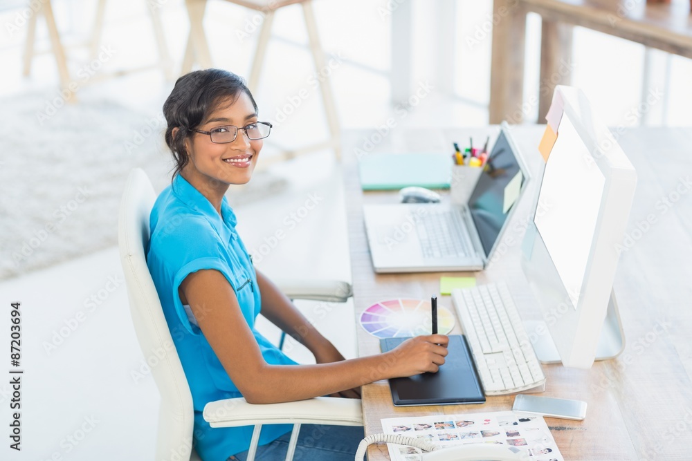 Smiling casual businesswoman working on digitizer Smiling casual businesswoman working on digitizer