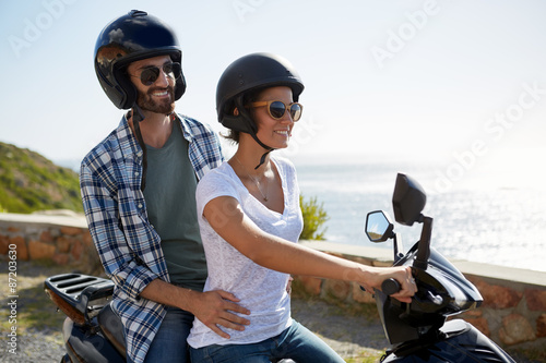 couple riding a scooter