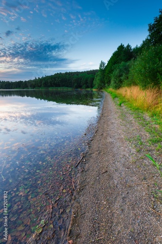 Beautiful lake at sunset landscape with cloudy sky