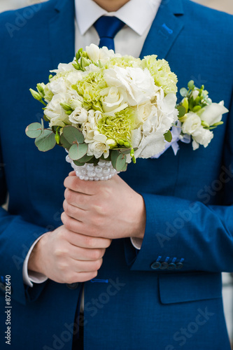 Big wedding bouquet before wedding ceremony. Bride or groom.