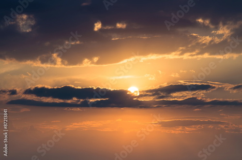 evening sun behind the clouds © balakleypb