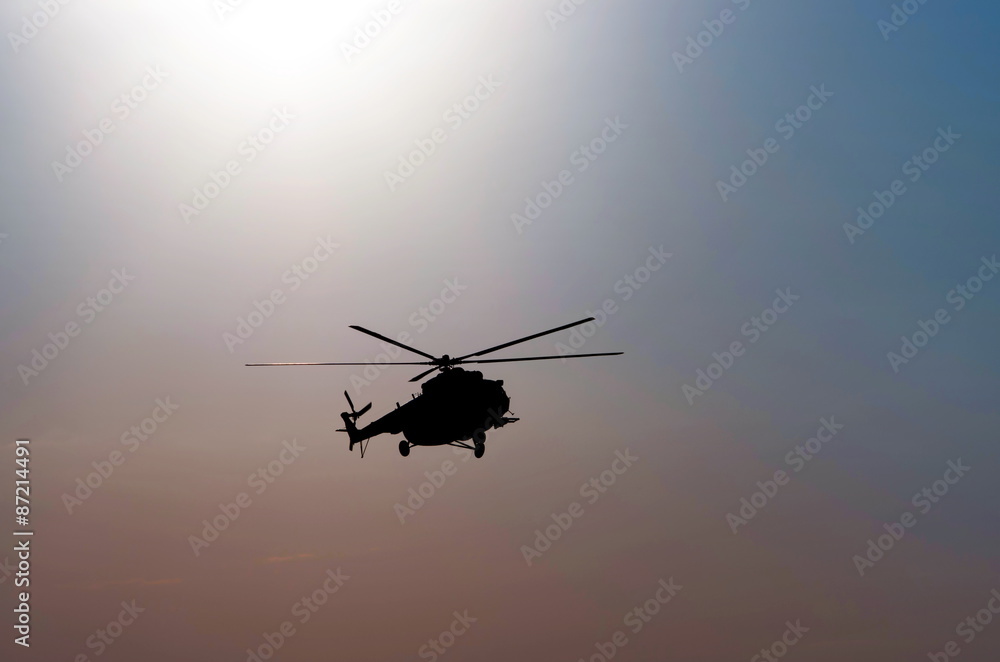 silhouette of the helicopter at dusk silhouette of the helicopter at dusk