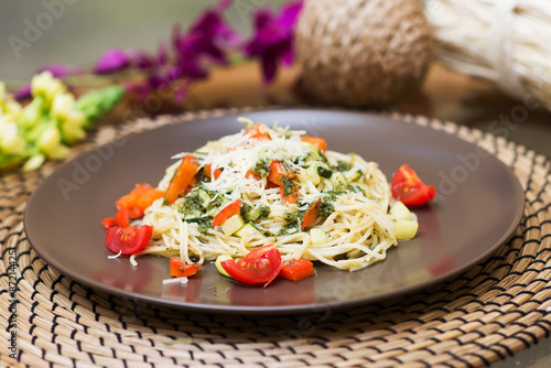 Pasta with tomato cherry and parmesan. Italian quisine photo