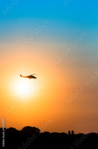 Support helicopter in the night sky