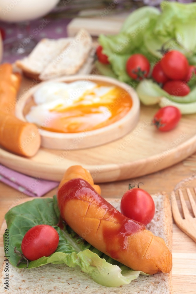 Breakfast with eggs, sausage, bread, salad vegetables and milk. Breakfast with eggs, sausage, bread, salad vegetables and milk.