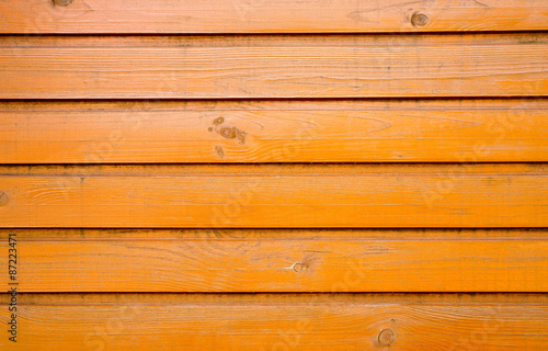Old wooden wall. Painted orange