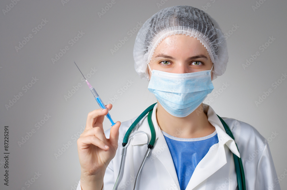 Female doctor with syringe Female doctor with syringe