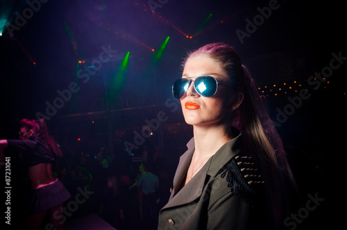 Girl in sunglass. The club