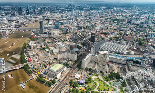 Photography Buildings of London along Thames river as seen from helicopter