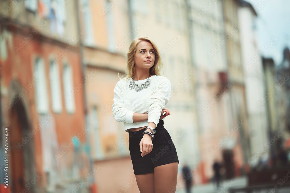 Outdoor portrait of beautiful young woman in Lviv