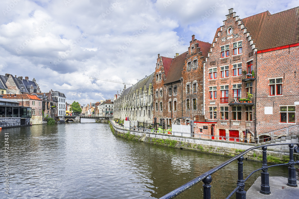 View of picturesque houses along channel in Ghent. Belgium.