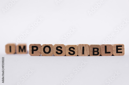 motivation text on wooden cubes, isolated on white background