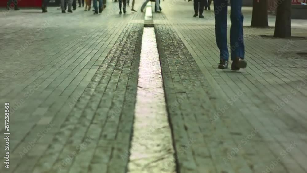 People walking on long walkway, no faces, sunny day. London. People walking on long walkway, no faces, sunny day. London.
