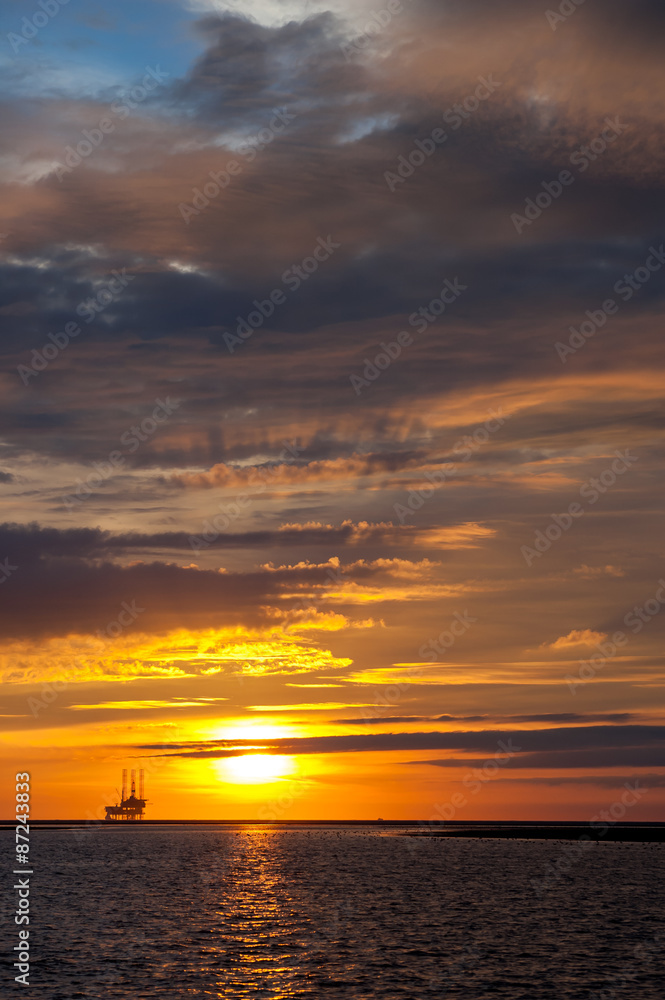 Offshore drilling platform at sunset, Netherlands