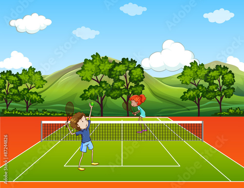 Kids playing tennis in park