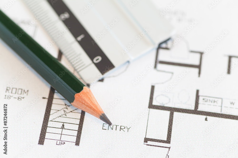 Architect rolls and plans construction project drawing . Architect rolls and plans construction project drawing .