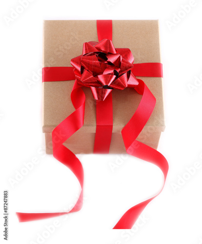 Brown paper gift box with red ribbon bow, isolated on white