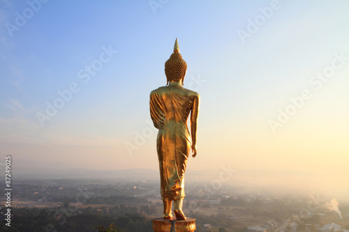 behind Buddha statue before sunrise time
