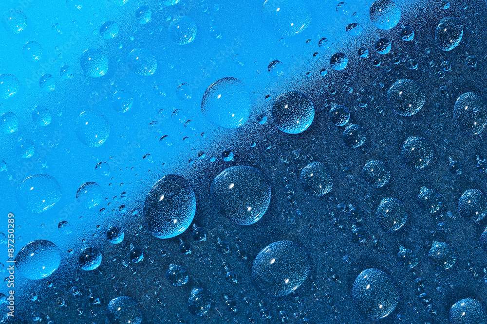 Water drops on the blue surface