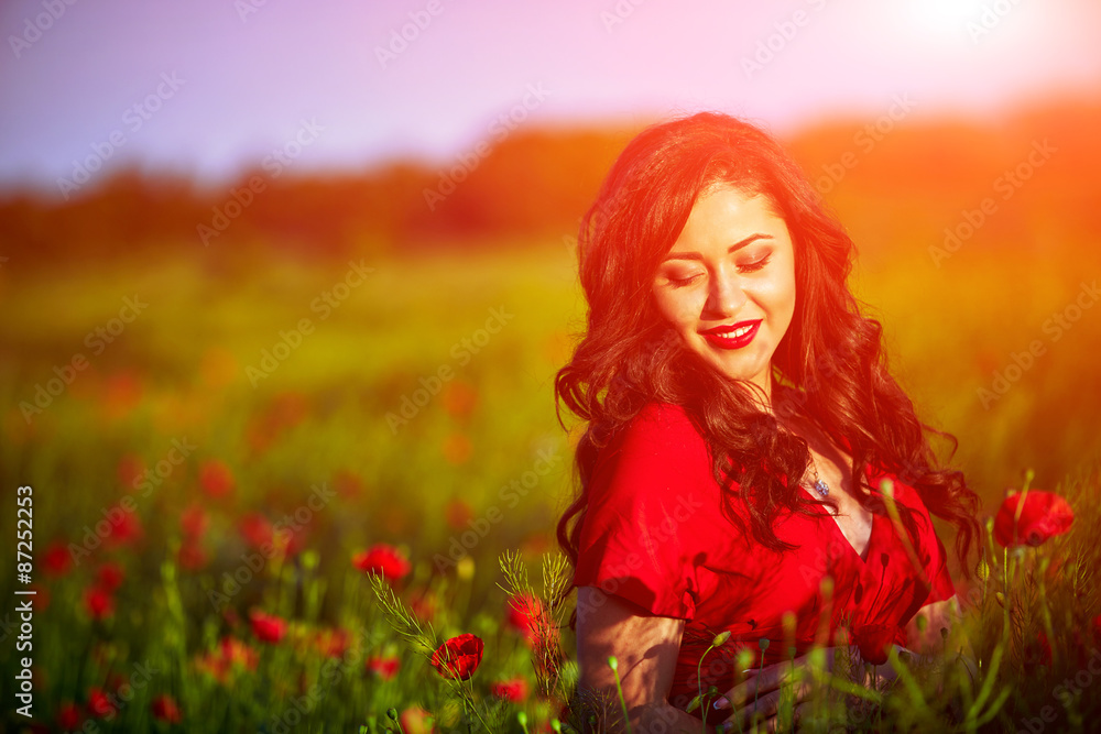 Beautiful woman in a poppy field with flowers Beautiful woman in a poppy field with flowers