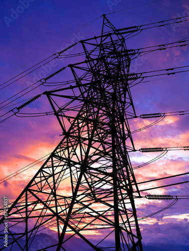 Silhouette of high voltage transmission towers.