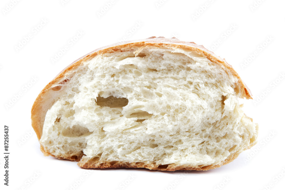 A loaf of fresh bread isolated on white background. A loaf of fresh bread isolated on white background.