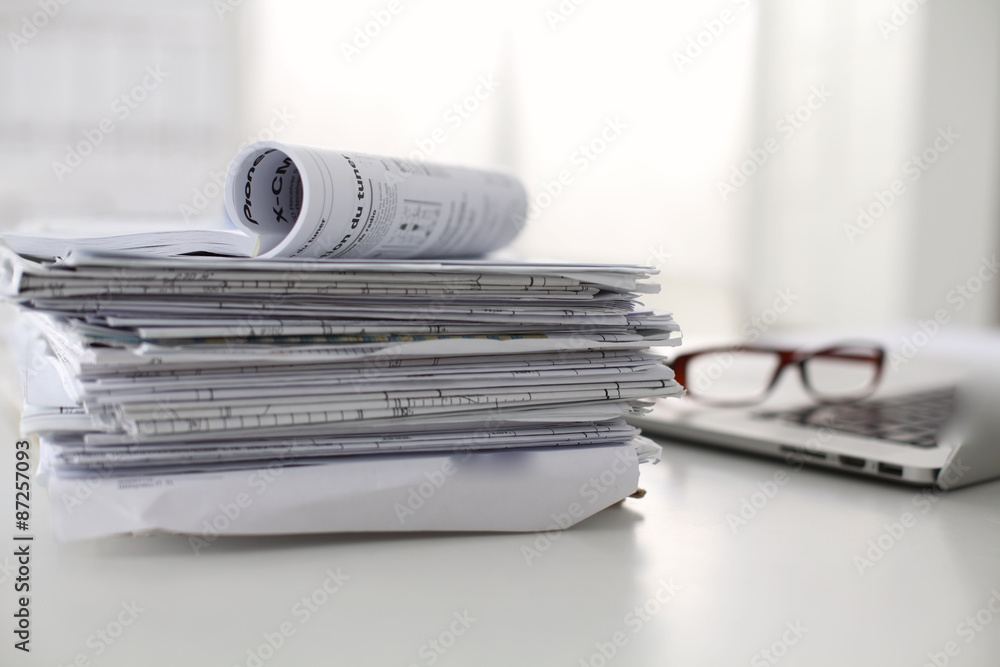 office desk a stack of computer paper reports work forms office desk a stack of computer paper reports work forms