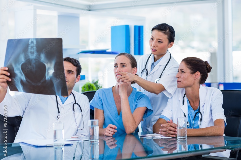 Fototapeta premium Team of doctors looking at xray