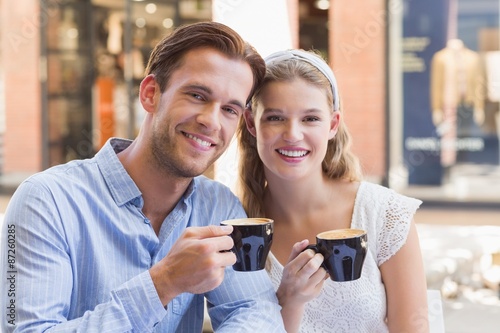 Cute couple drinking a coffee together