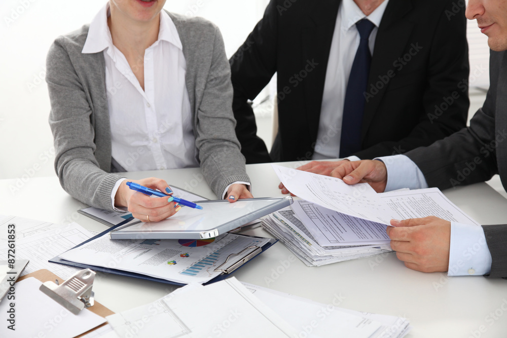 Business people handshake, sitting at the table Business people handshake, sitting at the table
