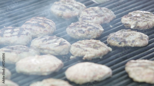 East European babequed meat balls and meat sticks on a grill. photo