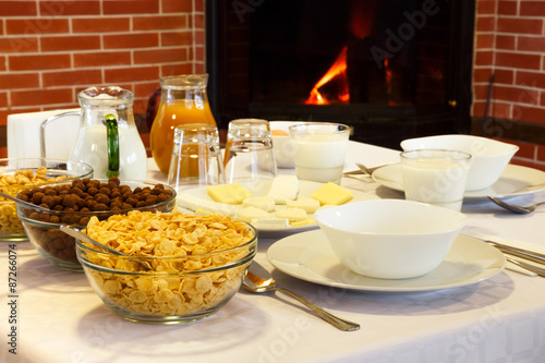 Hotel breakfast near the fireplace comfort