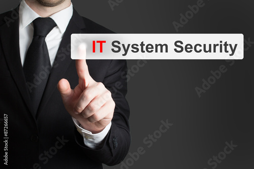 businessman pushing button it system security