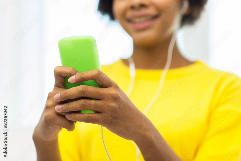 happy african woman with smartphone and headphones happy african woman with smartphone and headphones