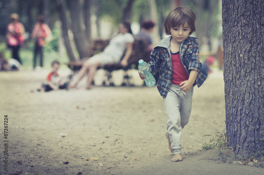 Fototapeta premium Cute young child boy or kid playing