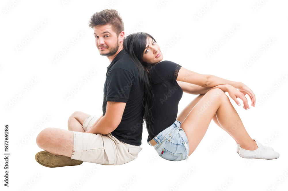 Happy couple sitting back to back Happy couple sitting back to back