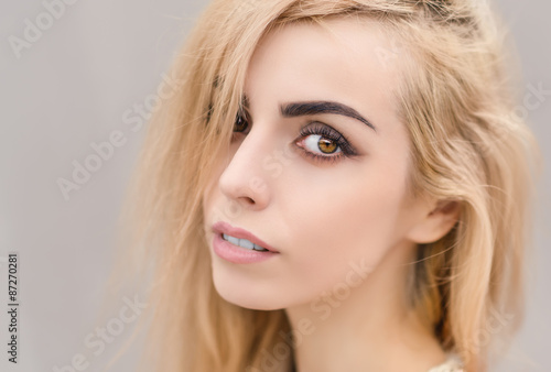 Portrait of a beautiful blonde girl close-up.