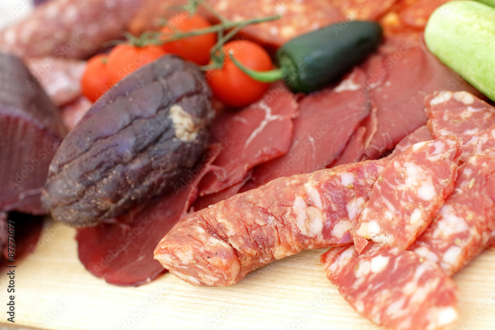 smoked meat products, vegetables on the table smoked meat products, vegetables on the table