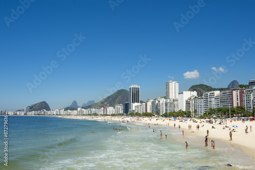 Scenic view of Copacabana Beach shore with skyline of Rio de Janeiro Brazil © lazyllama