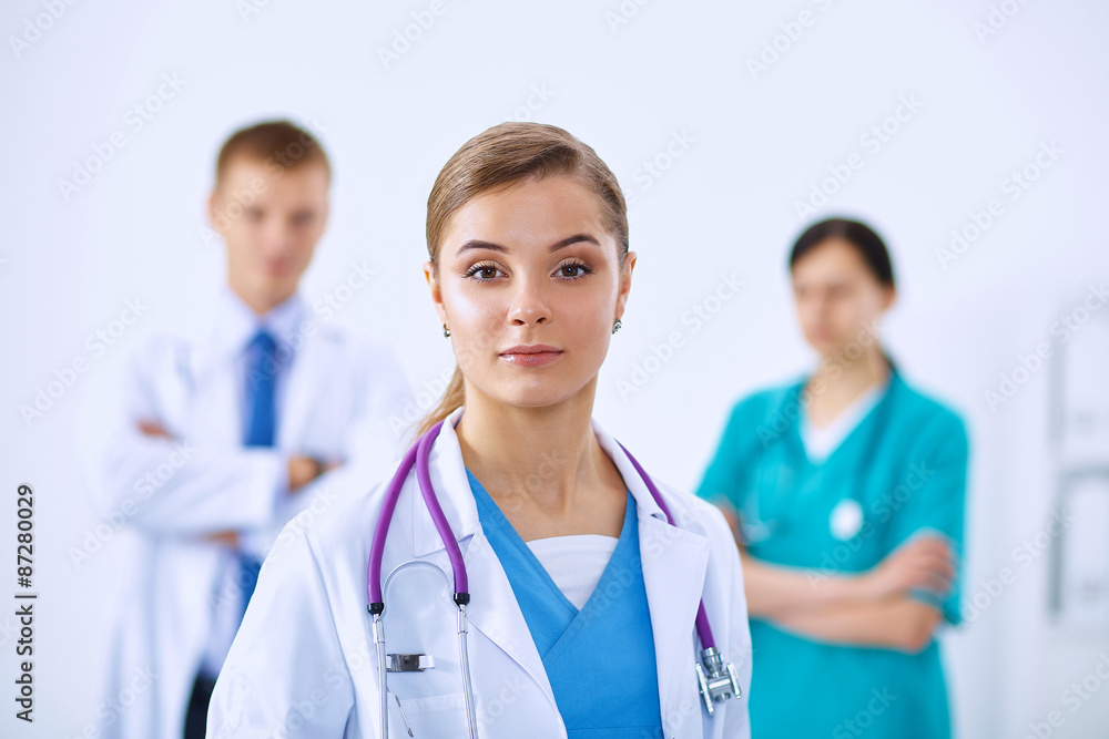 Woman doctor standing with stethoscope at hospital Woman doctor standing with stethoscope at hospital