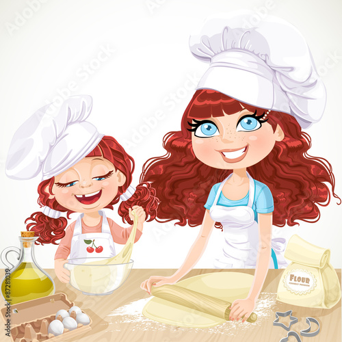 Curly hair mom and daughterl baking cookies
