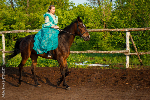 Horsewoman riding.