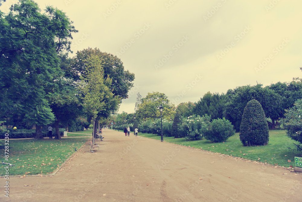 One of the largest green areas in the center of Barcelona - Parc de la Ciutadella, on a cloudy day in early autumn. Image filtered in faded, washed out, retro style; nostalgic travel vintage concept. One of the largest green areas in the center of Barcelona - Parc de la Ciutadella, on a cloudy day in early autumn. Image filtered in faded, washed out, retro style; nostalgic travel vintage concept.